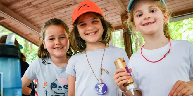 Group of campers working together on a craft project