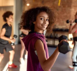 teen lifting weights
