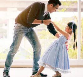 Dad and a daughter dancing