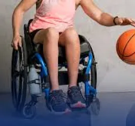 Adapted sports player showing their basketball skills while seated in a wheelchair 