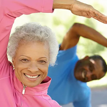 Two adults participating in Tai Chi