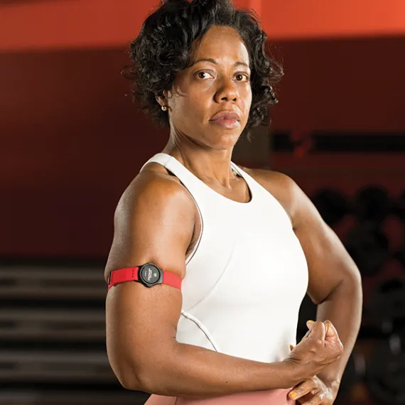 woman posing with a myzone band