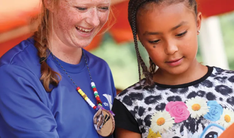 Counselor and girl at YMCA day camp