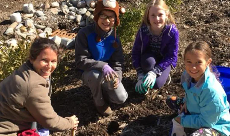YMCA Volunteers work in community garden
