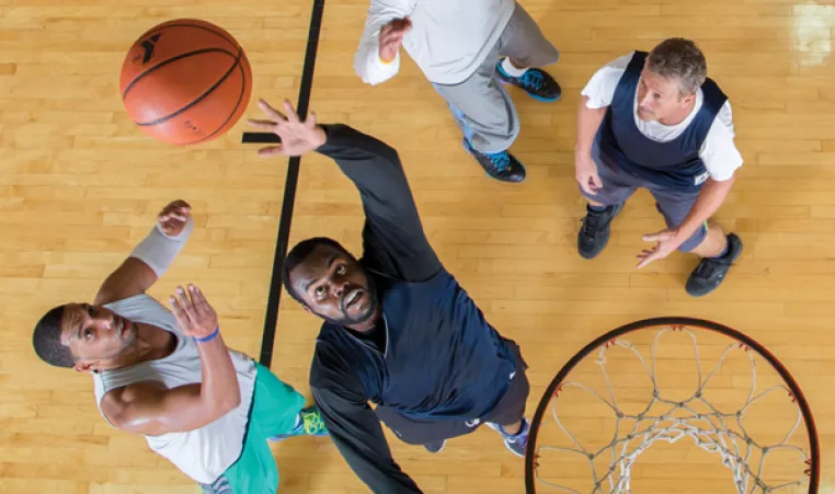 Men playing basketball at YMCA