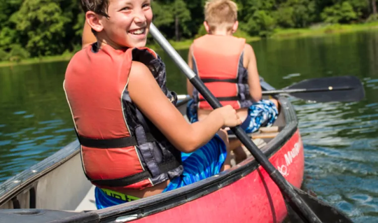 kids canoeing at Camp Kanata