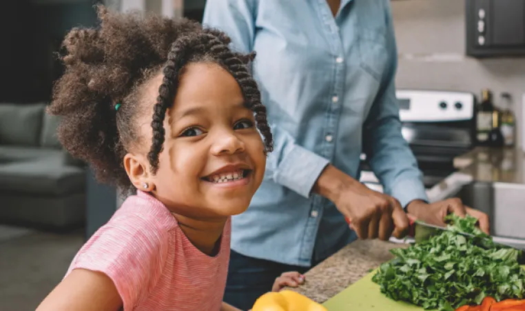 Mom and daughter working together in the kitchen