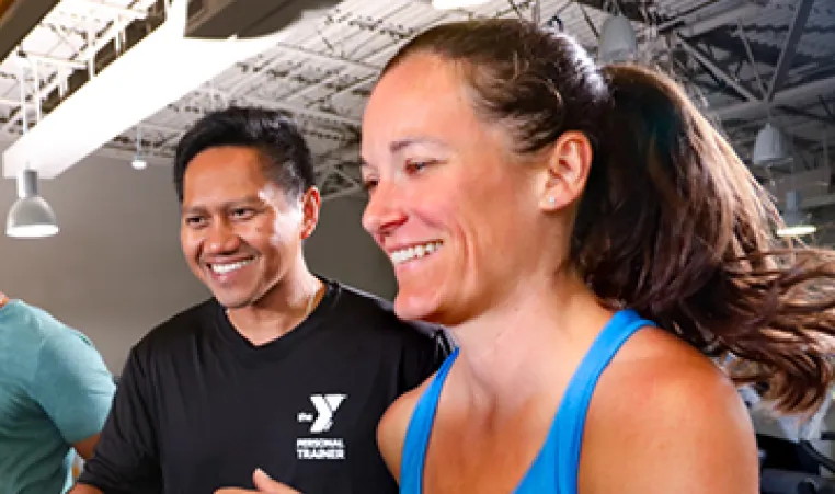 Personal Trainer with member at the YMCA