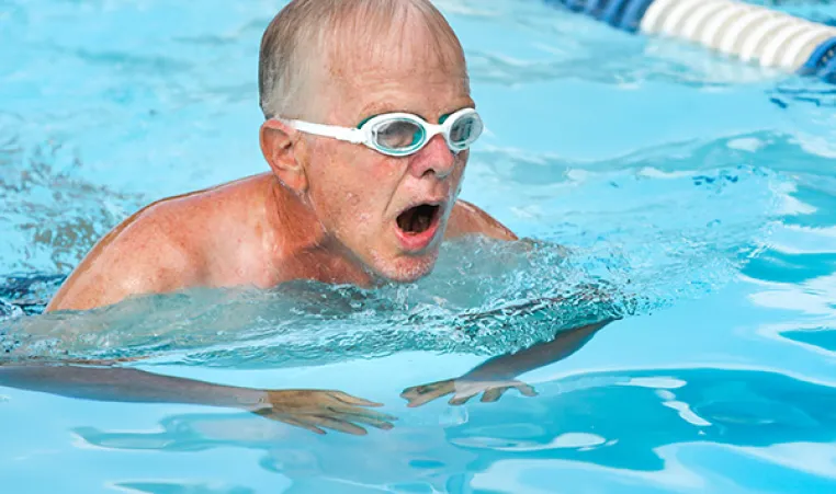 Older man swimming