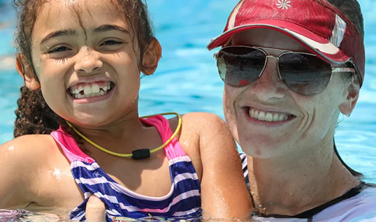 Mom and daughter in swimming pool