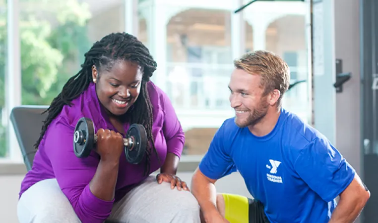 Woman working out with personal trainer