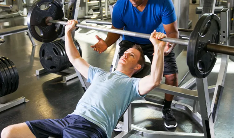 Man working out with personal trainer