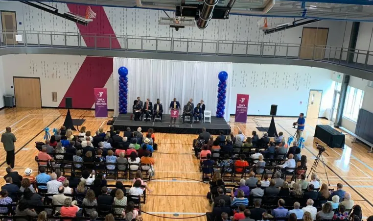 Guests gather in the gym of the Southeast Raleigh YMCA
