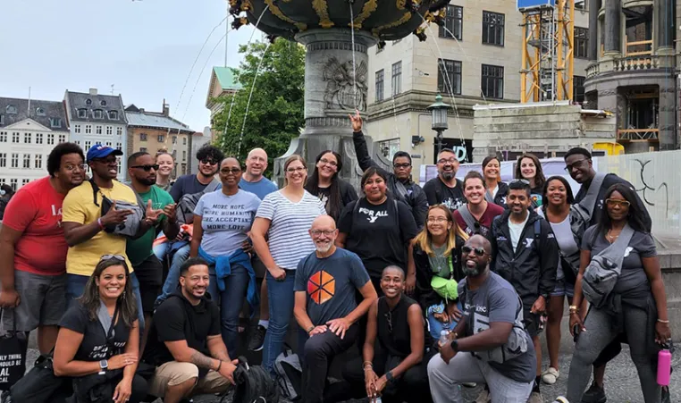 a group of people standing near a fountain in Denmark