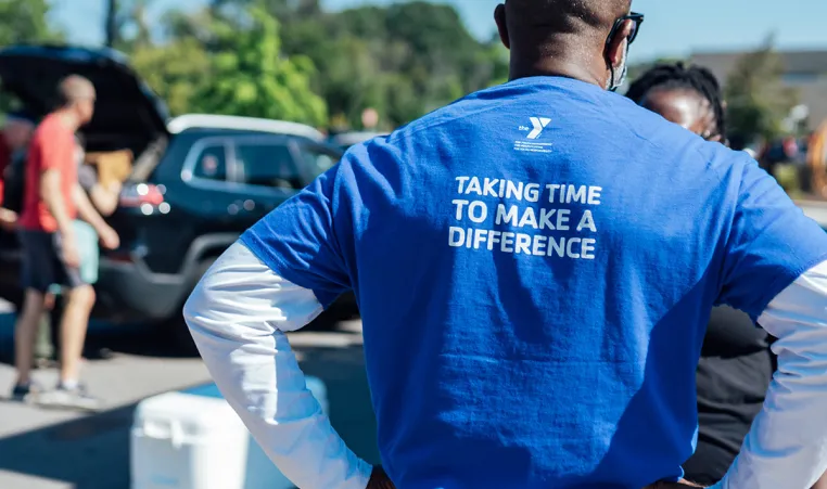 a YMCA volunteer at a food drive