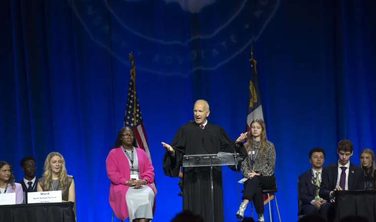 Judge speaking to students