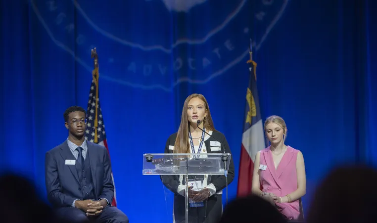 Teen speaking at podium
