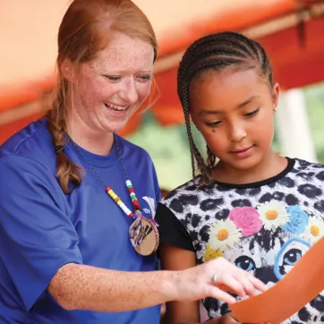 Counselor and girl at YMCA day camp