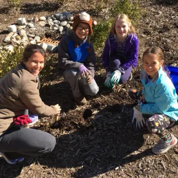 YMCA Volunteers work in community garden
