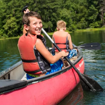 kids canoeing at Camp Kanata