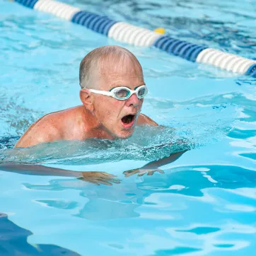 Older man swimming