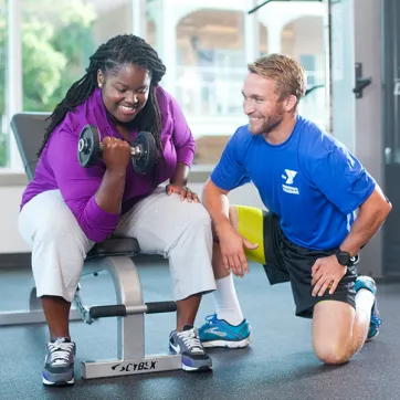 Woman working out with personal trainer