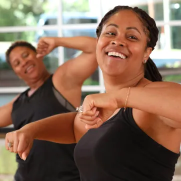 two women in a YMCA zumba class
