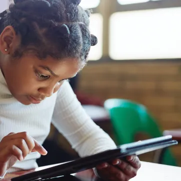 Girl in class with ipad