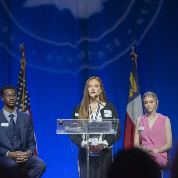 Teen speaking at podium