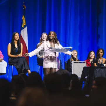 Teen speaking on stage