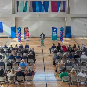 YMCA of the Triangle CEO speaks for a crowd at the ribbon-cutting for the new YMCA Youth Center