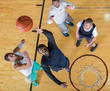 Men playing basketball at YMCA