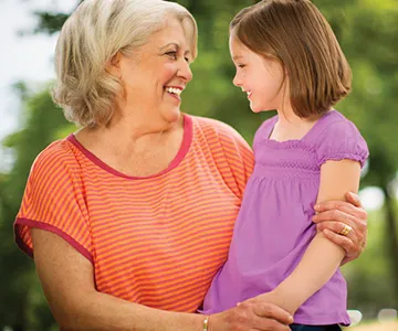 Grandmother and daughter sitting outside