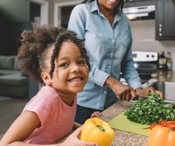 Mom and daughter working together in the kitchen