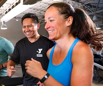 Personal Trainer with member at the YMCA