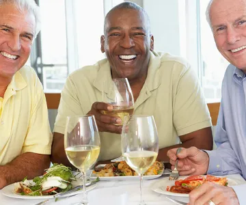 Old retired men eating out