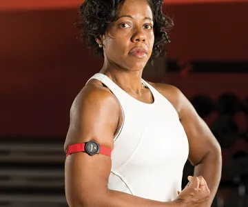 woman posing with a myzone band