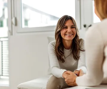 woman speaking with mental health professional