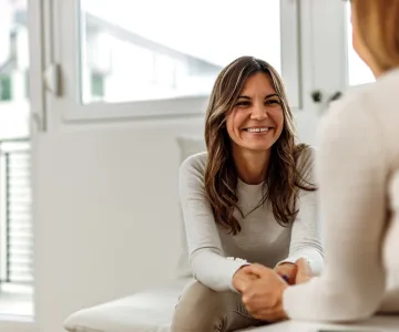woman speaking with mental health professional