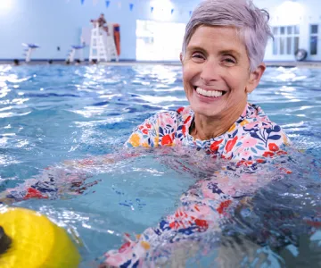 female senior at a water fitness class