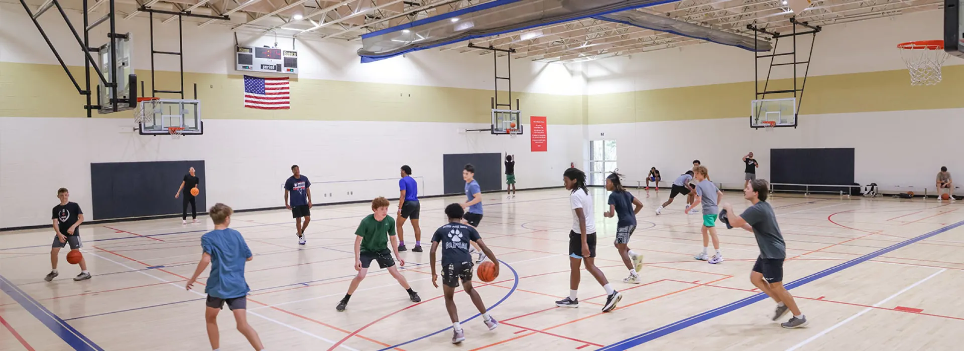 AE Finley YMCA members playing basketball in gym